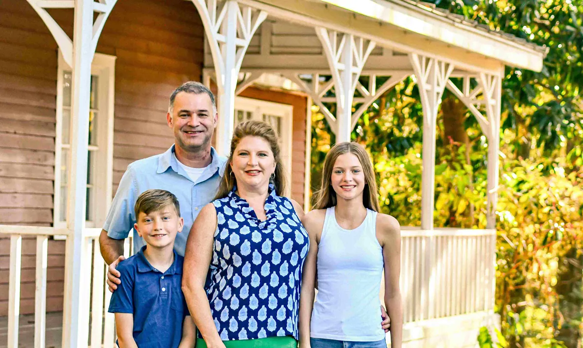 The Wake Forest Vacation Rentals host family outside a home